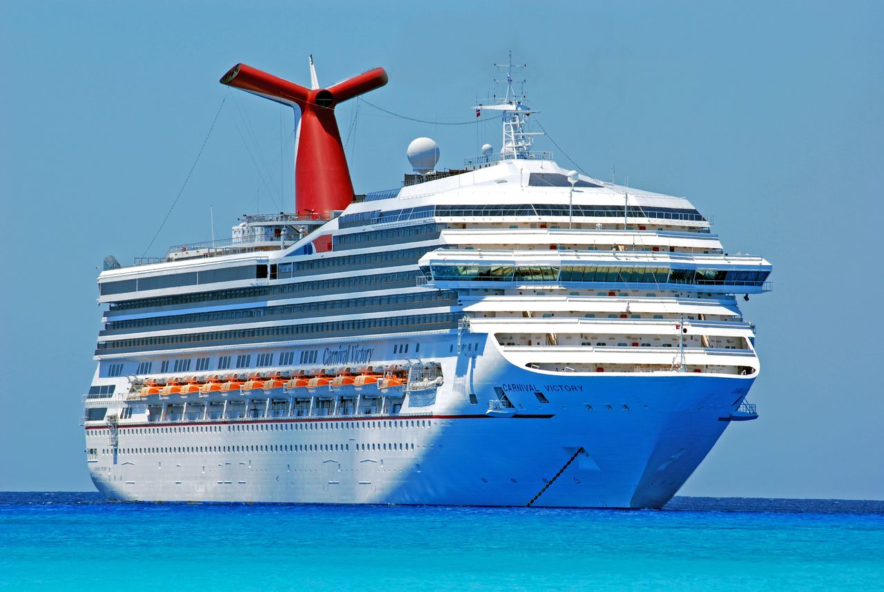 Mastering the First Impression: Your intriguing post title goes here A large cruise ship gliding through clear blue ocean waters on a sunny day.