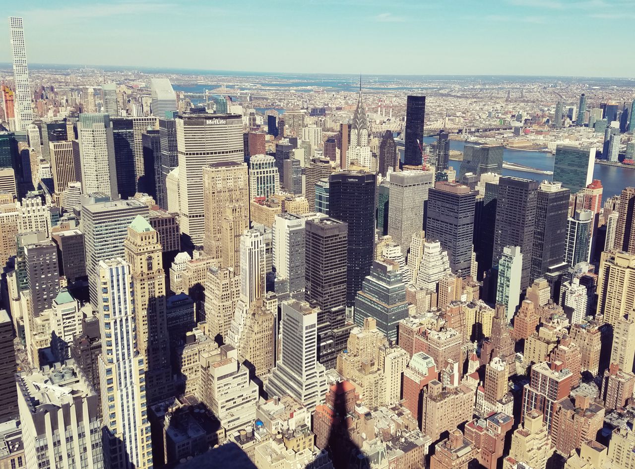 who-we-are Breathtaking aerial view of New York City's modern skyline with iconic skyscrapers.