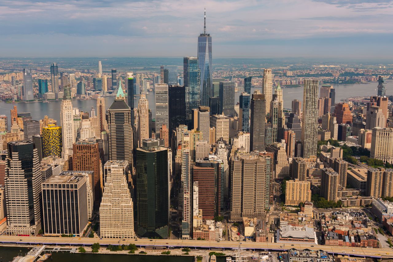 our-story Stunning aerial view of New York City skyline featuring the iconic One World Trade Center.